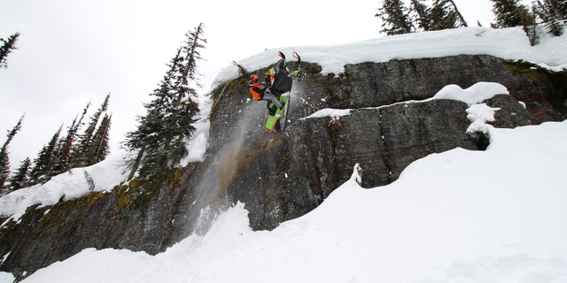 Caleb Kesterke sailing through the air on an Arctic Cat Ascender snowmobile