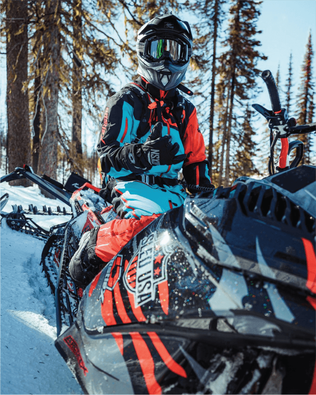 A Sled USA snowmobile club member sitting on a Ski-Doo Gen5 sled.